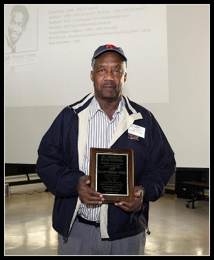 A person holding a plaqueAI-generated content may be incorrect.